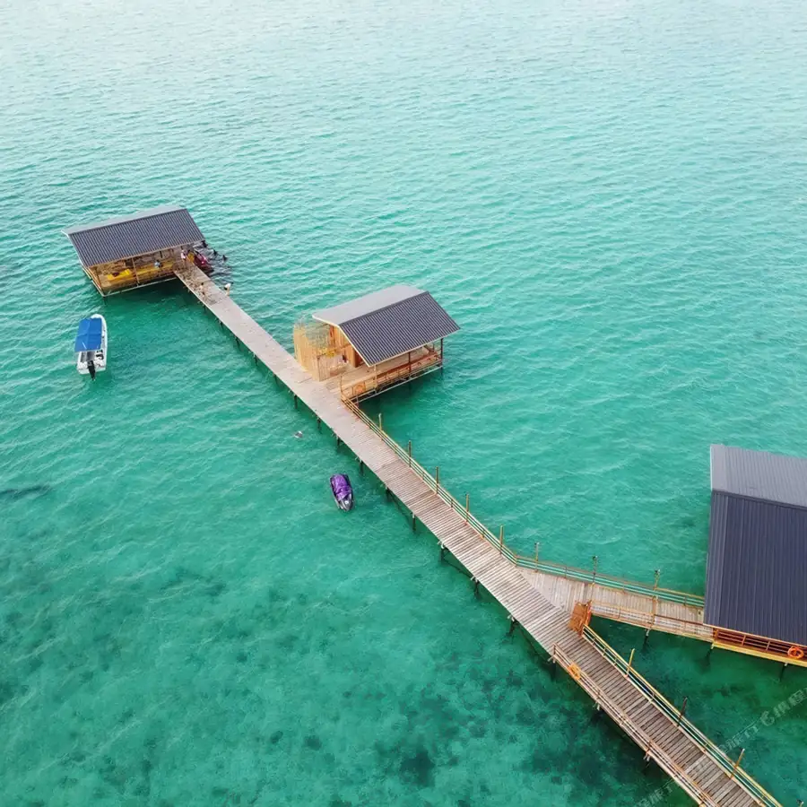 Aerial drone shot of the overwater resort layout Dreamy Wave Dwelling Resort